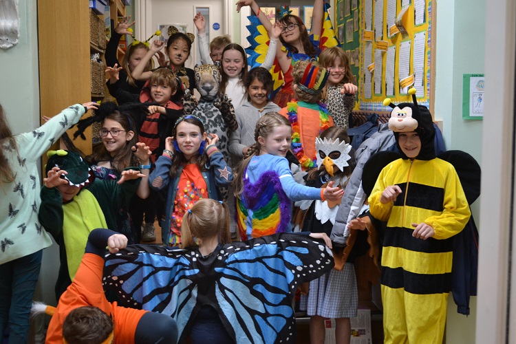 group of school children in different animal costumes