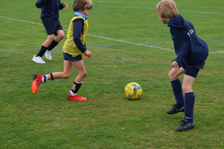 Students from a London prep school playing at a football tournament