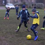 children playing football