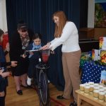 child on a bicycle pedalling away to mix the fruit in the smoothie machine