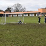 school kids playing football