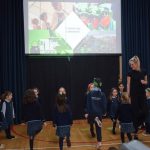 children dancing with the teacher