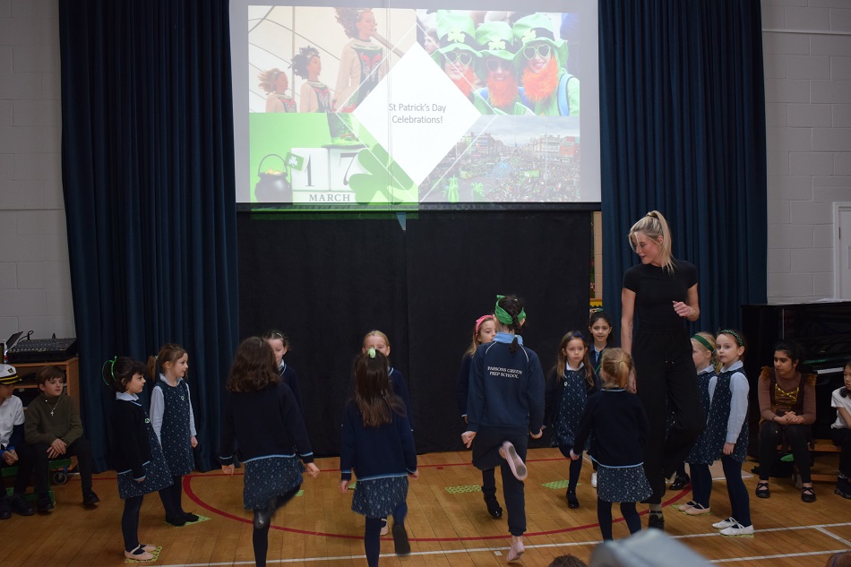 children dancing with the teacher