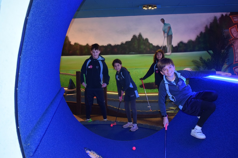 children playing minigolf