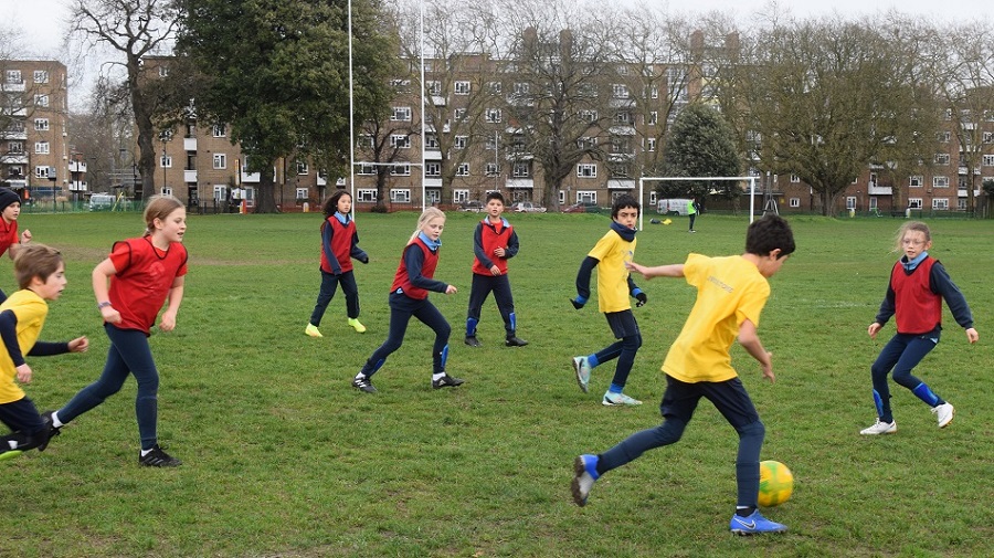 children playing football