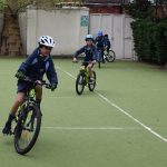 boys on bikes wearing helmets