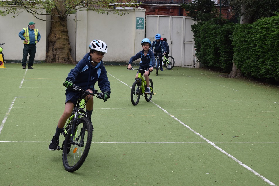 boys on bikes wearing helmets