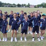 Students with arms around each other