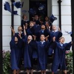 Students throwing caps in the air