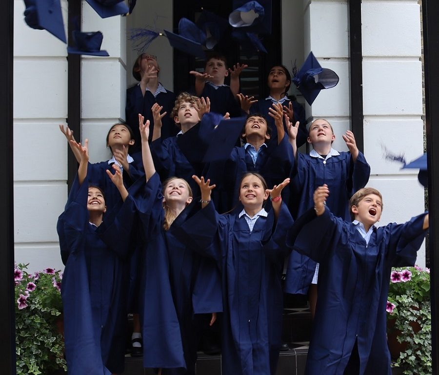 Students throwing caps in the air