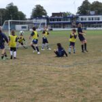 students playing football