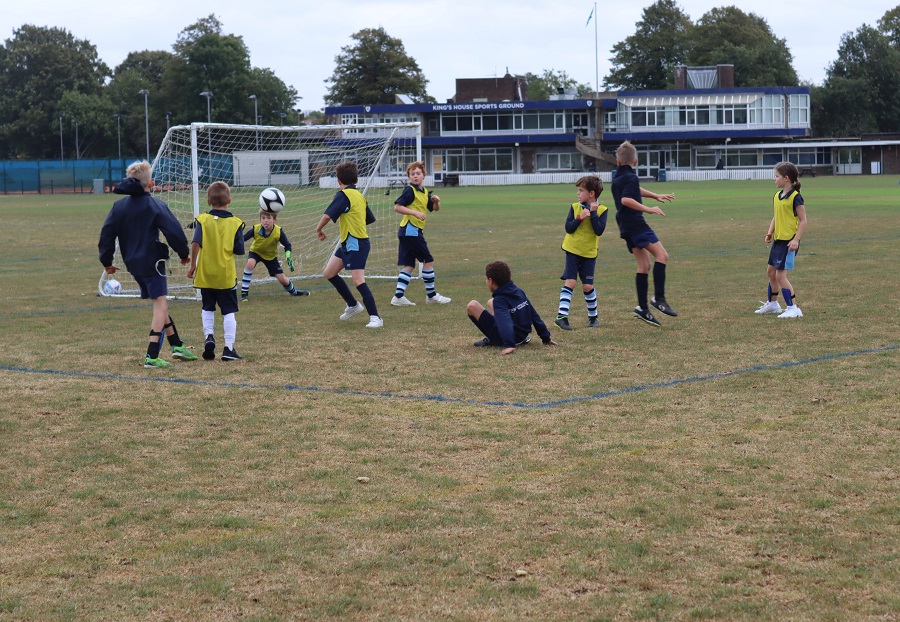 students playing football