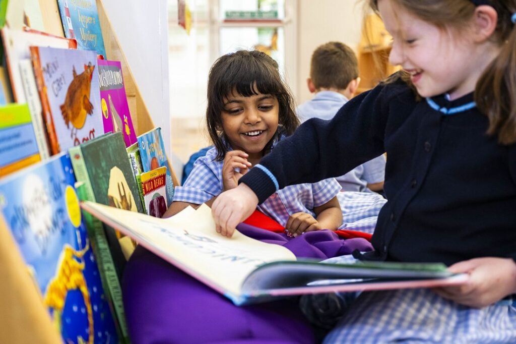 students reading a book