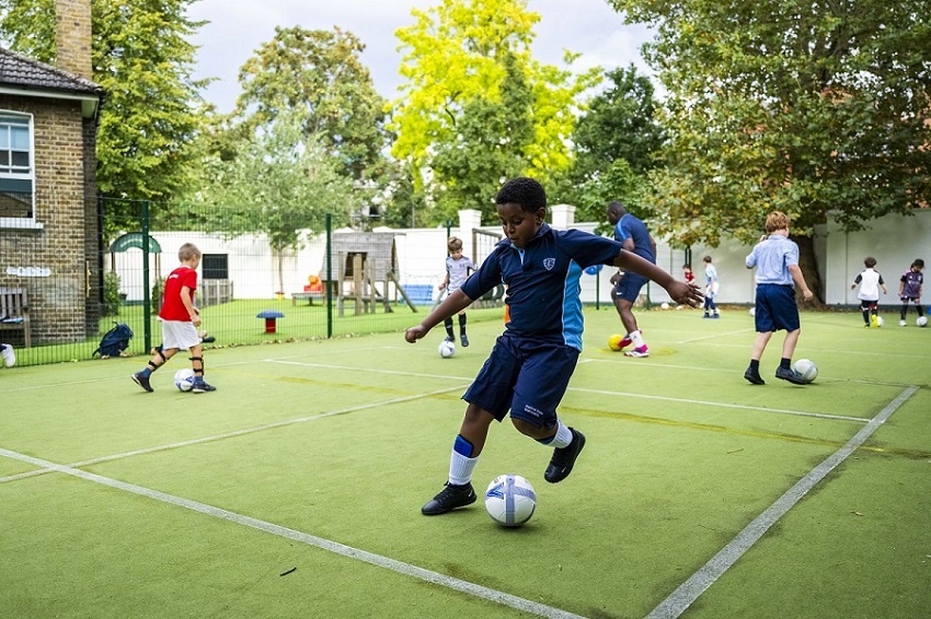 boys playing football