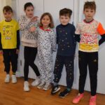 students in spotty clothes