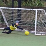 boy saving a goal