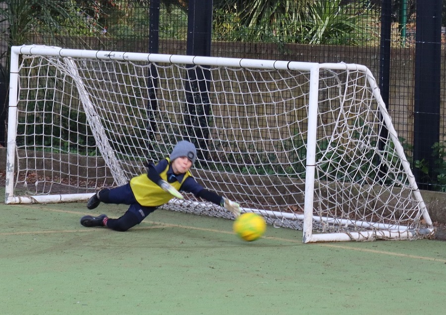 boy saving a goal