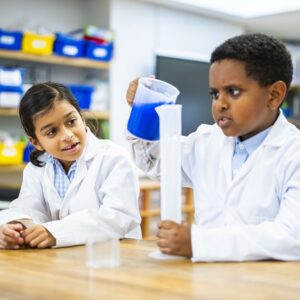 2 students conduction a science experiment