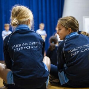 students sat on the floor