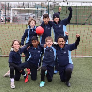 students in a football goal