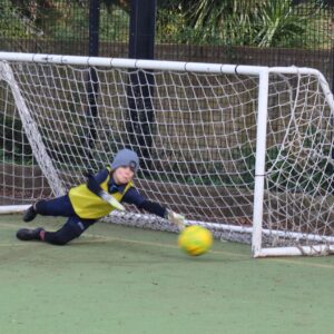 student saving a goal